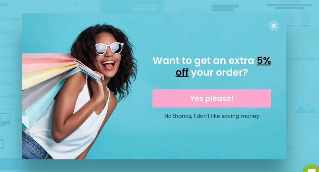 optinmonster-popup-coupon-lead-magnet - OptinMonster Popup with a photo of a woman holding shopping bags. "Want to get an extra 5% off your order?" CTA button says "Yes please!" and linked text below says "No thanks, I don't like saving money.