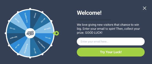 Spinwheel welcome message example-min - OptinMonster Spin-the-wheel welcome message example. It says "Welcome! We love giving new visitors that chance to win big. Enter your email to spin! Then, collect your prize. Good Luck!" Then there's an email signup form and button.